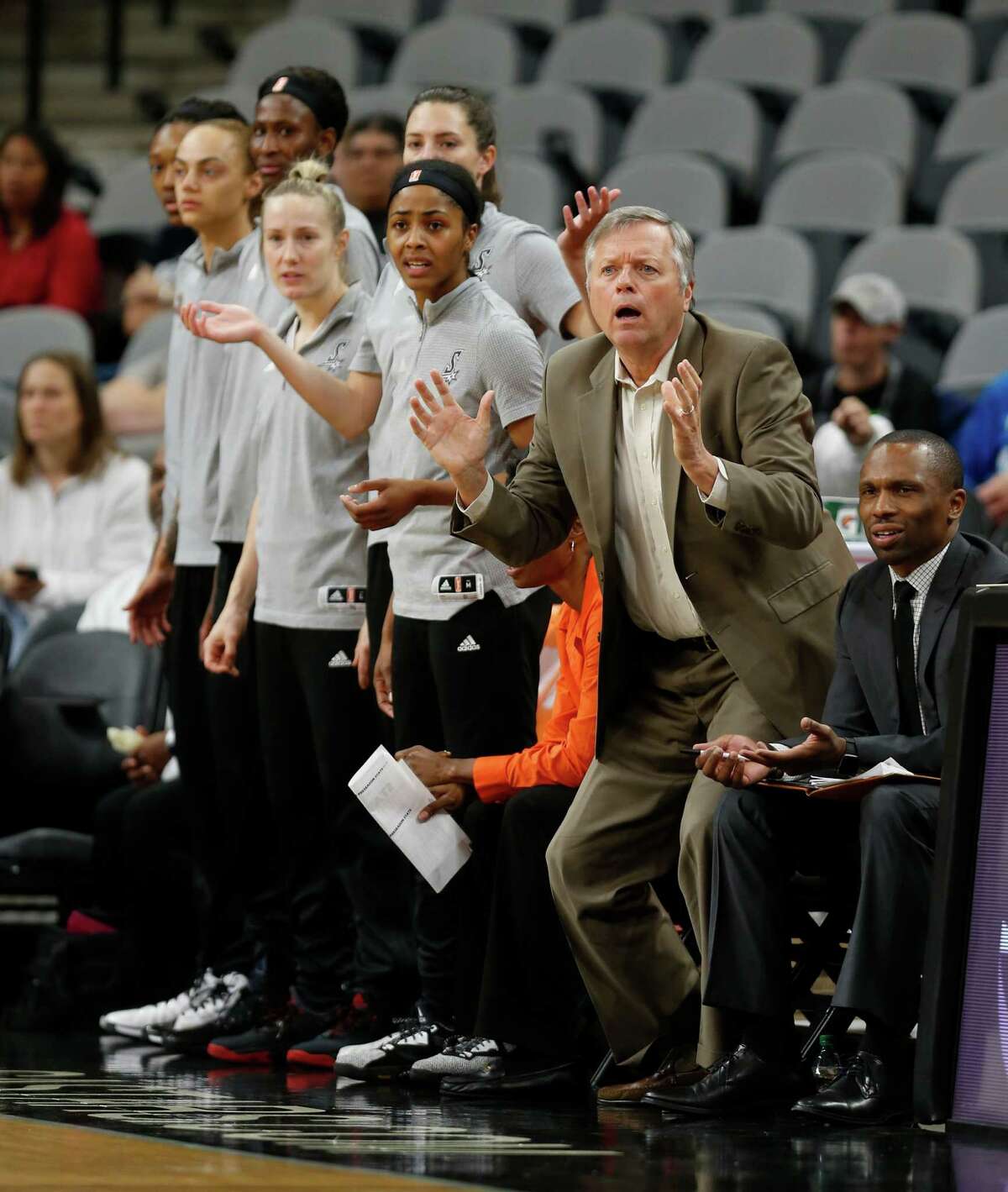 San Antonio Stars head coach Dan Hughes and his bench react during a call in their game against the Connecticut Sun in the first half at AT&T Center on May 18, 2016