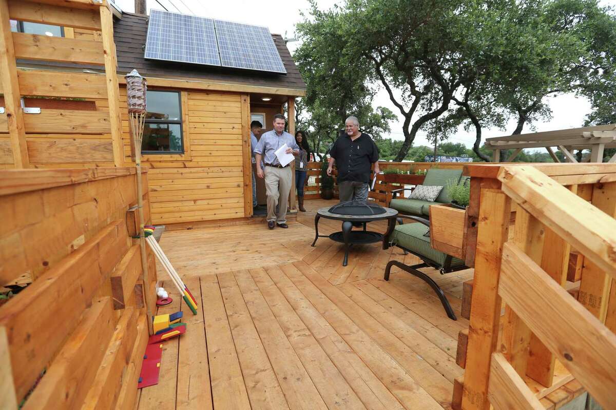 Frank Sitterle left, of Sitterle Homes, and Gilbert Sanchez of HomeWerks, leave a tiny home built by seniors at Construction Careers Academy as they judge the home Wednesday morning, May 18, 2016. The students built the home for the third annual Parade of Homes competition, sponsored by the Northside Independent School District. The four homes are all fully-functional buildings that are 152 square feet or less.