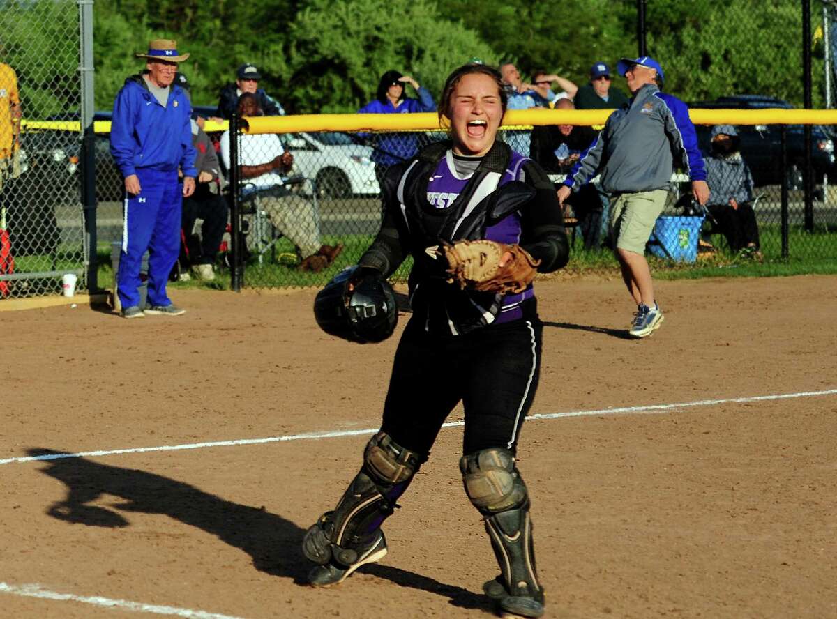 Westhill catcher Jordan Benzaken celebrates after the team beat Seymour 4-3 in softball action in Seymour, Conn., on Thursday May 19, 2016.