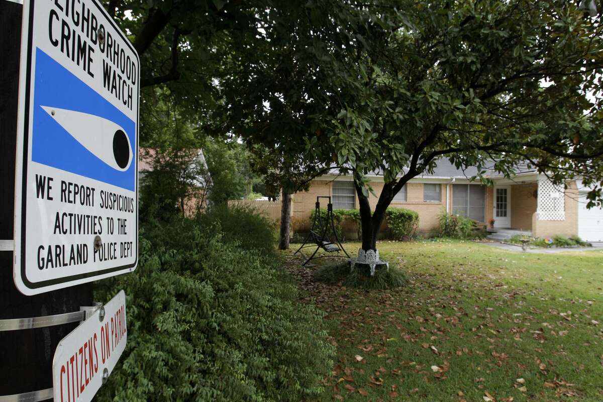 The home of Darlene and Alan Nevil is shown Wednesday, Aug. 18, 2010, in Garland, Texas. A 13-year-old boy and his 12-year-old girlfriend will be charged with murder and aggravated assault in a shooting that killed a suburban Dallas woman and wounded her husband, police said Wednesday. (AP Photo/Tony Gutierrez)