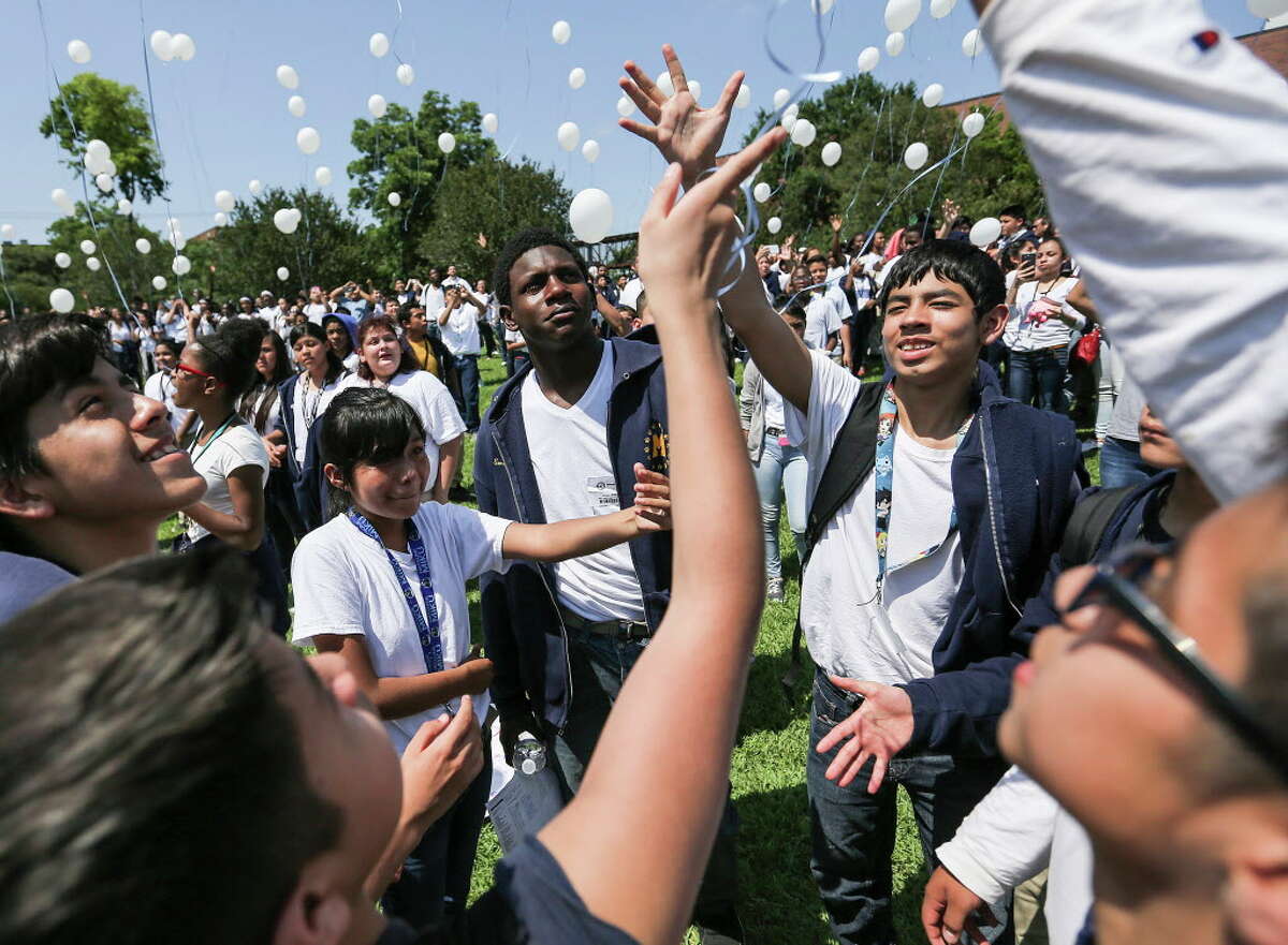 Marshall Middle School students release balloons after a vigil for Josue Flores, 11, a classmate who was stabbed while walking home from school on Friday, May 20, 2016, in Houston.