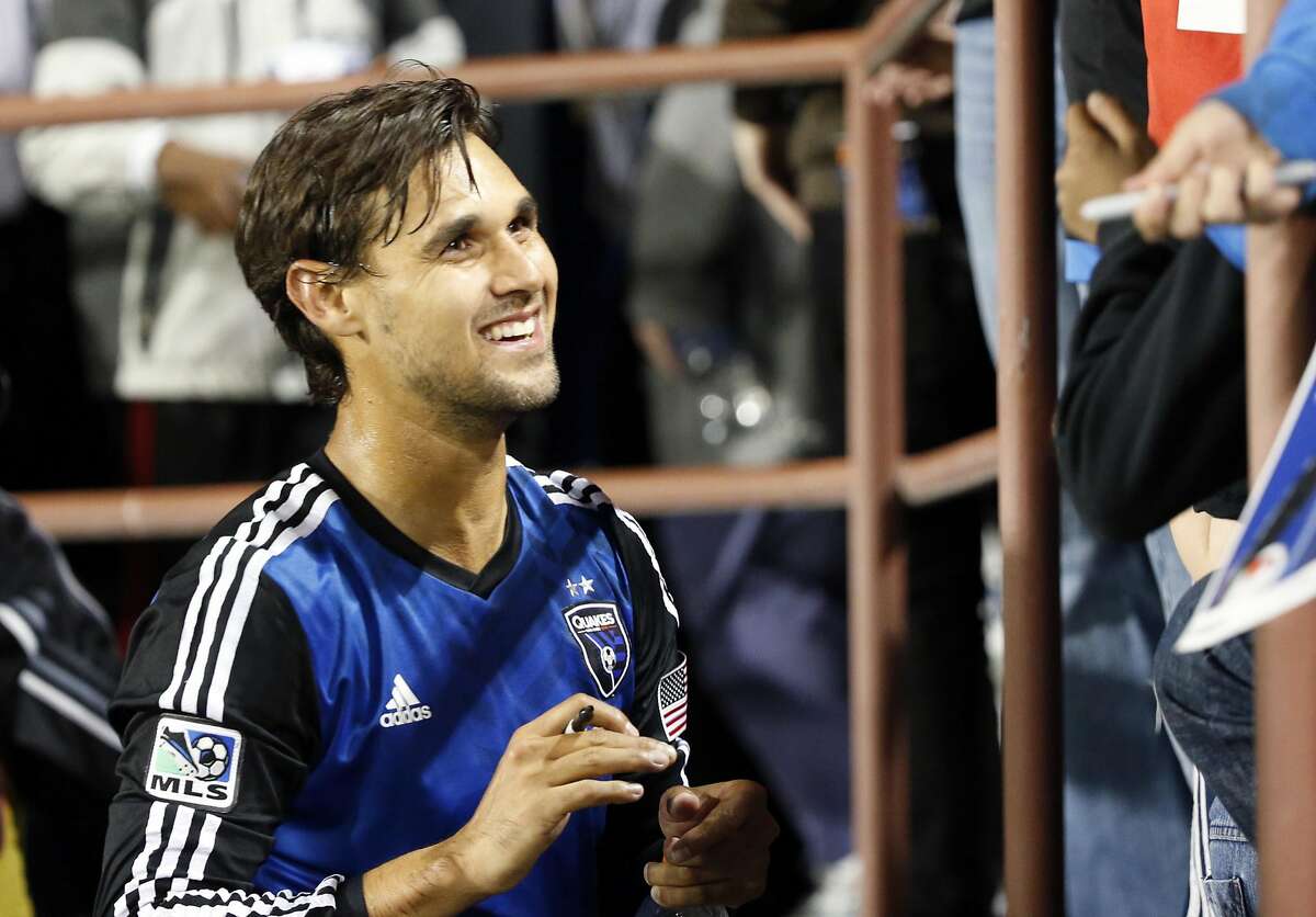 Apr 26, 2014; Santa Clara, CA, USA; San Jose Earthquakes forward Chris Wondolowski (8) signs autographs for fans in the stands after the game against the Chivas USA at Buck Shaw Stadium. San Jose won 1-0. Mandatory Credit: Bob Stanton-USA TODAY Sports