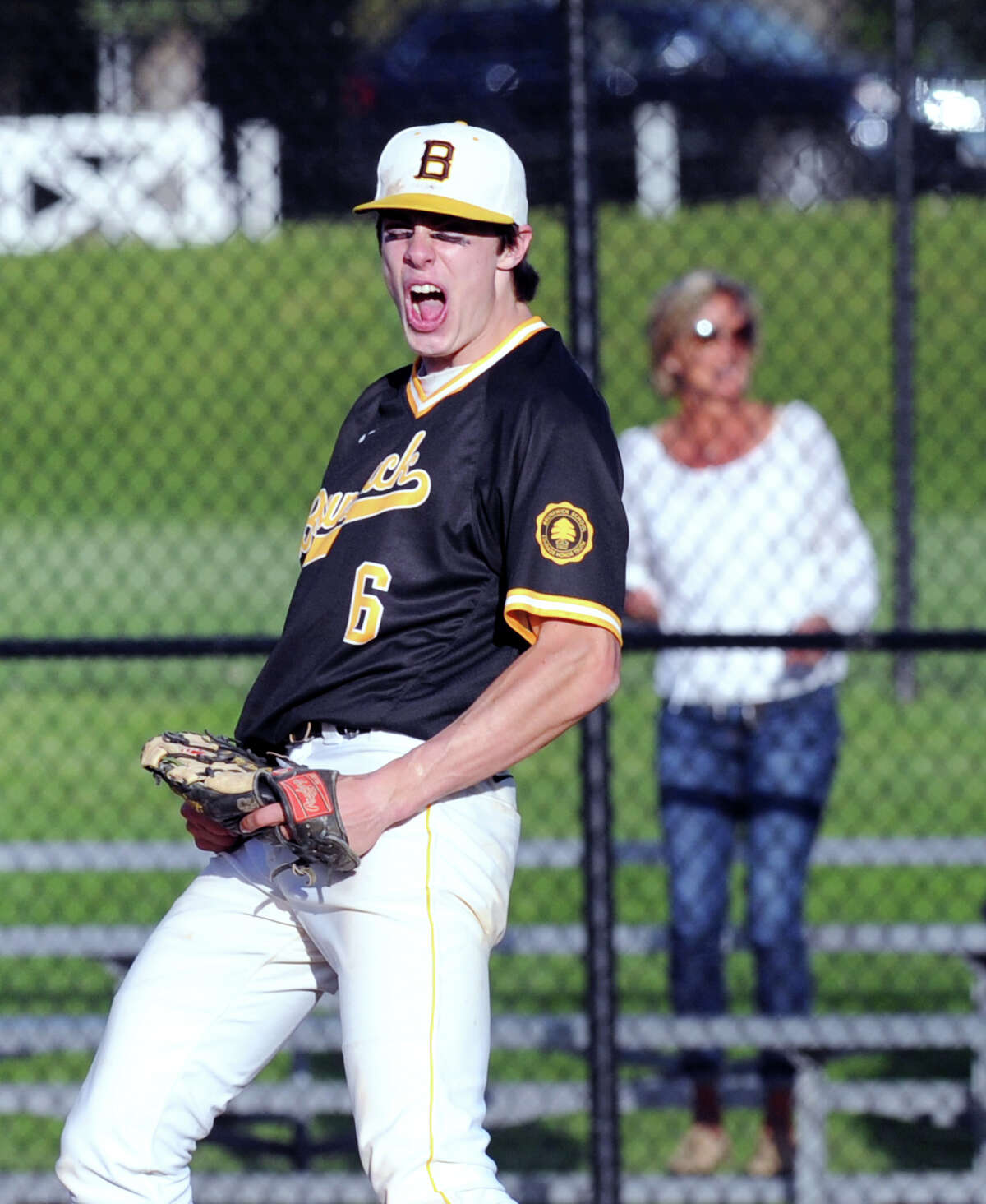 Brunswick relief pitcher Trevor Johnson celebrates after striking out the final Hamden Hall batter in the Bruins’ 7-1 win over Hamden Hall in the FAA championship in Greenwich.