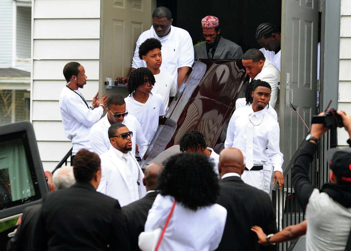 Pallbearers carry out the casket at the funeral of shooting victim Kah'Lil Sloan-Diaz at Calvary Temple Christian Center on Barnum Avenue in Bridgeport, Conn., on Saturday May 21, 2016.
