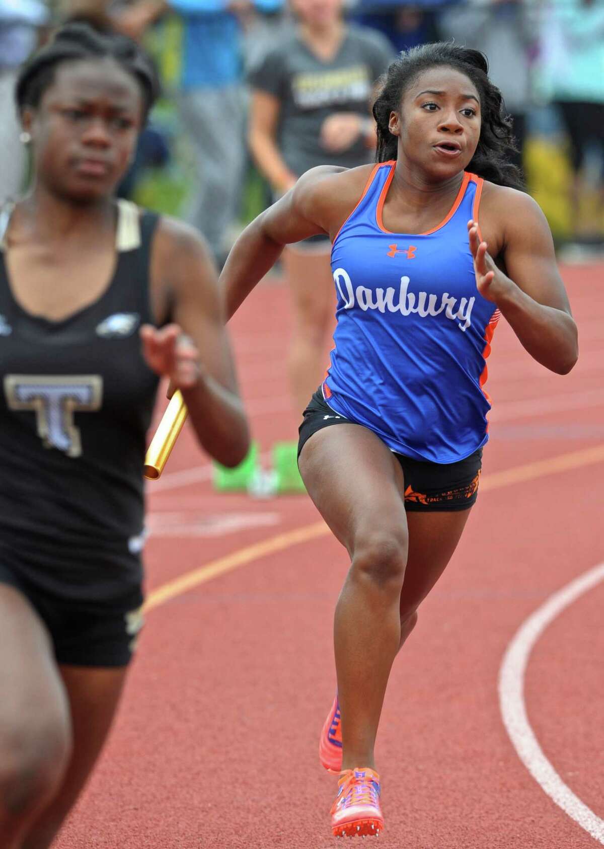 Saintphanie Porcenat runs the first leg of the girls 4x100 meter relay for Danbury during the FCIAC girls track championships, held at Bethel High School, Saturday, May 21, 2016, in Bethel, Conn.
