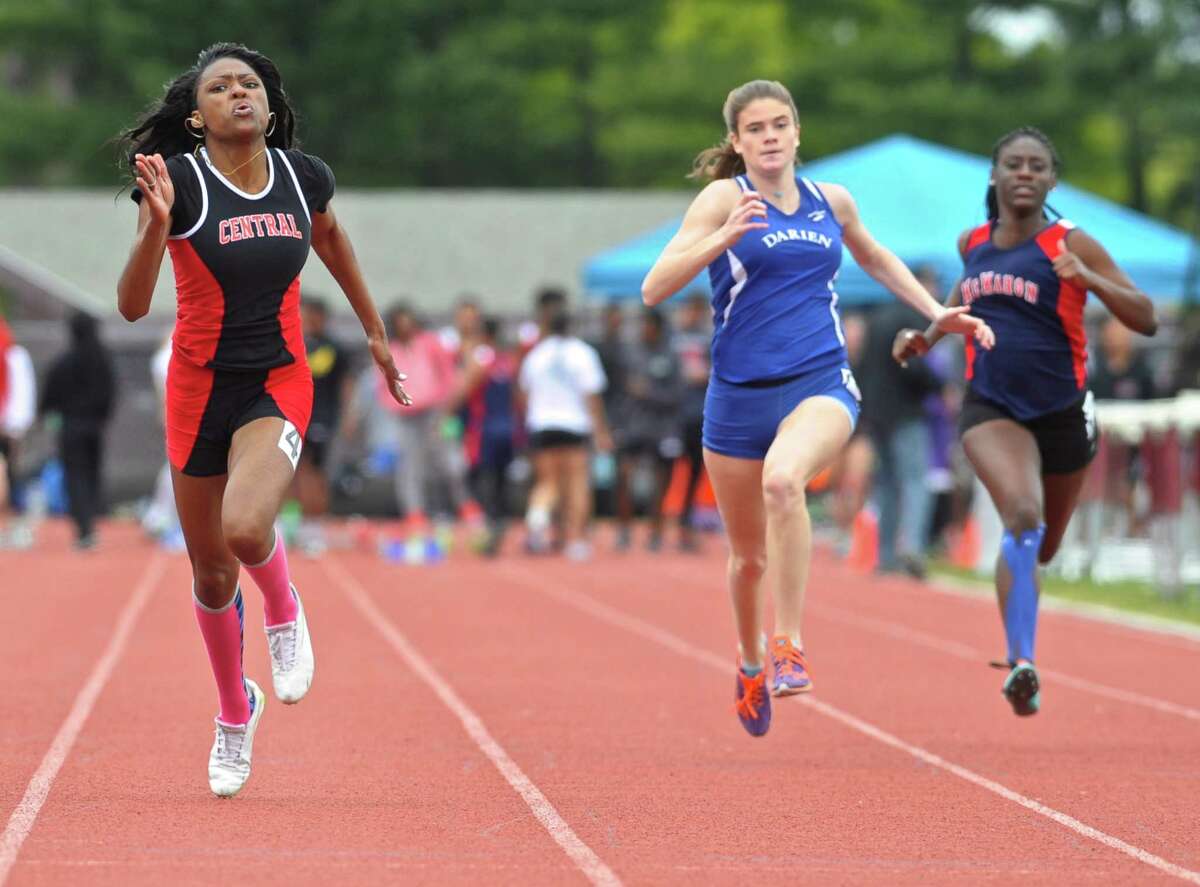 Bridgeport Central's Kanajzae Brown leads Darien's KC Grady and Brien McMahon's Jazmin Bien-Aime in a heat of the 100 meter dash at FCIAC girls track championships, held at Bethel High School, Saturday, May 21, 2016, in Bethel, Conn.