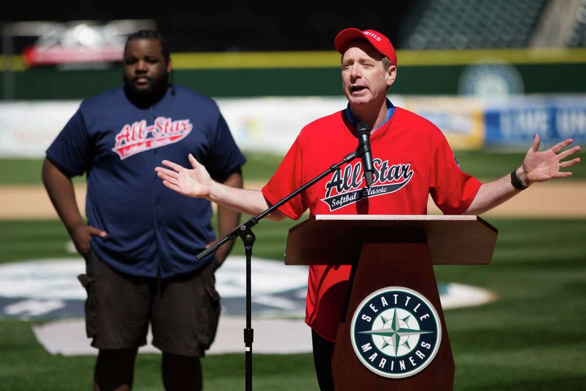 Microsoft's Brad Smith speaks before the All Star Softball Classic to benefit United Way King County, at Safeco Field, Sunday, May 22, 2016.