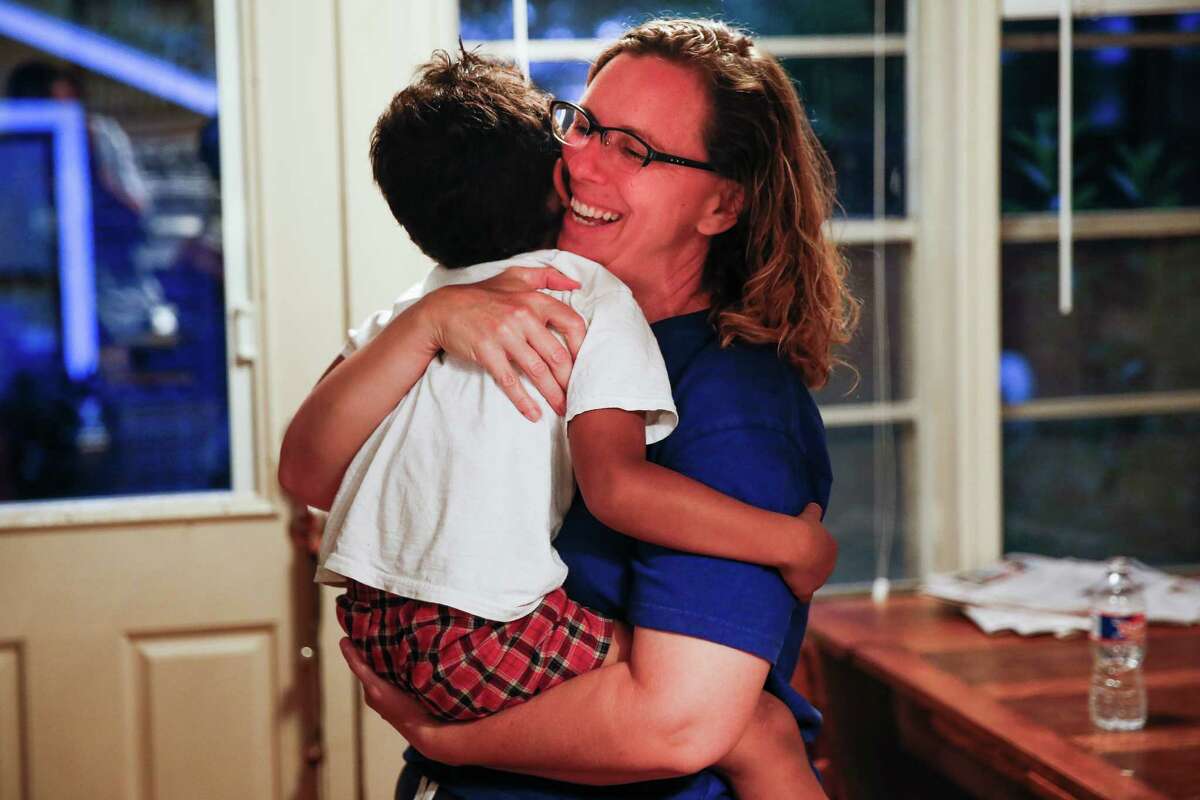 Angela Sugarek laughs and hugs her four-year-old foster child at their house Monday, May 23, 2016 in Houston. The foster parents, Sugarek and Carol Jeffery, welcomed their two foster kids, brothers ages 3 and 4, back into their home almost two months after Child Protective Services took the kids away after they reported the youngest child was being abused by an older brother.