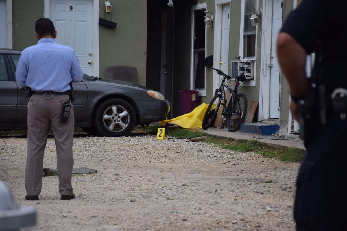 SAPD investigates a shooting scene in the 2300 block of East Houston Street that left one man dead on the East Side Tuesday morning, May 24, 2016.