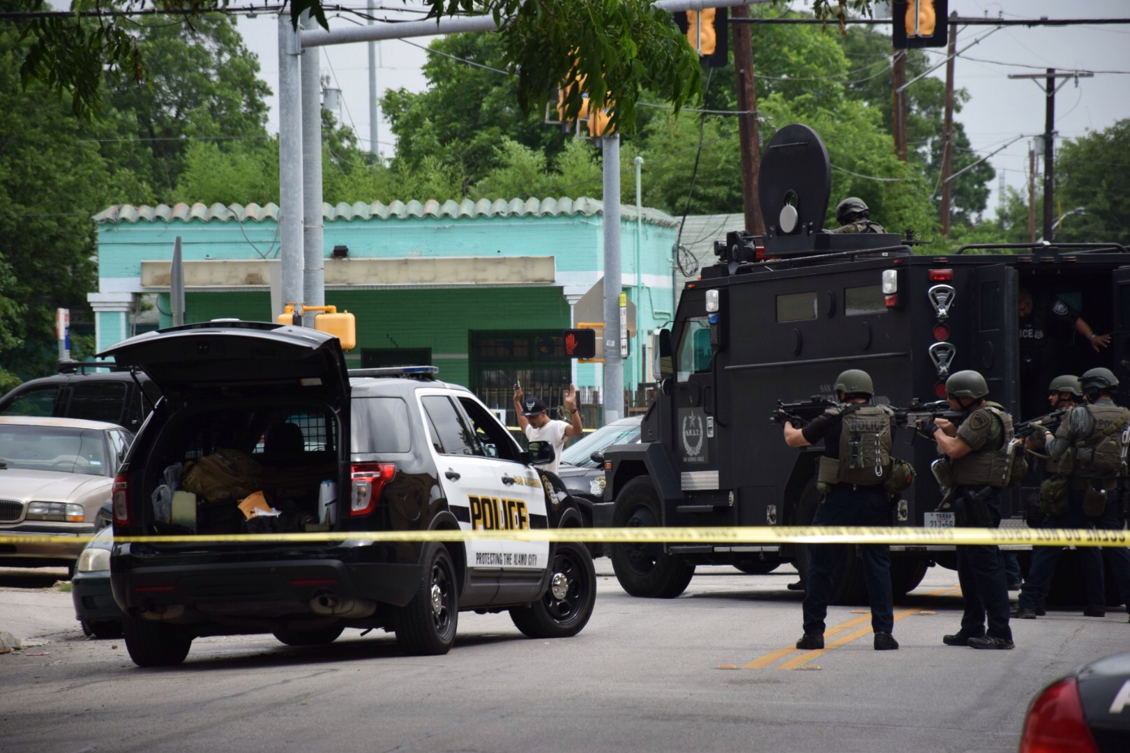Shooting suspect leaves apartment with hands up after brief standoff