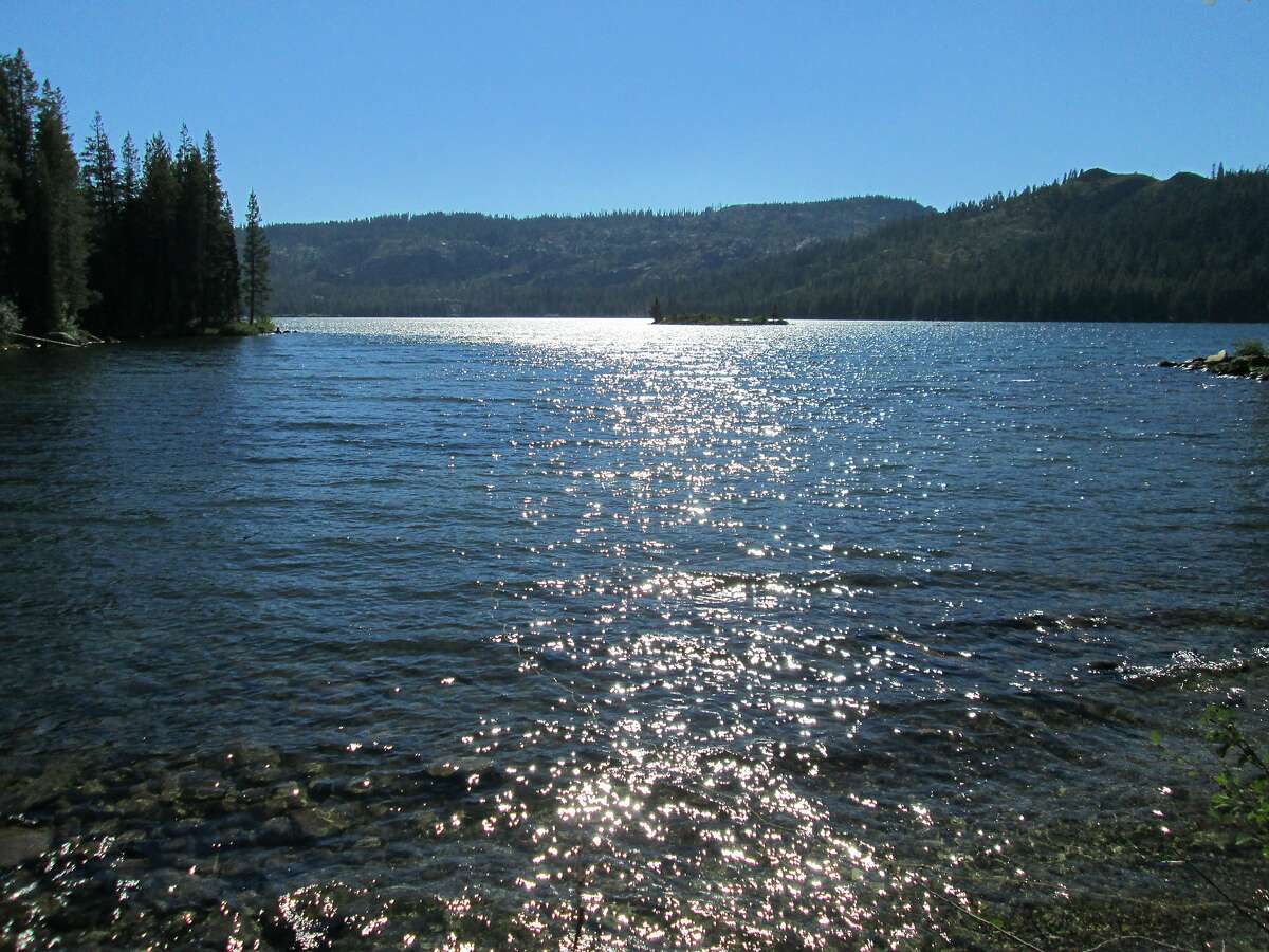 Gold Lake, shimmering the afternoon sun, looking toward the west end of the lake, is one of the centerpieces of the Lakes Basin Recreation Area, located along Gold Lake Road in Plumas County.� It is located on the west flank of the Sierra Nevada.