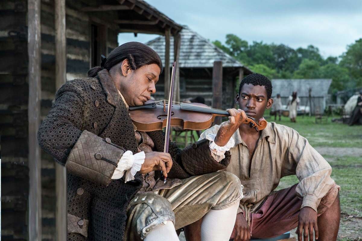Fiddler (Forest Whitaker, left) becomes a father figure to Kunta Kinte (Malachi Kirby), who rebels against his status as a slave in “Roots.”