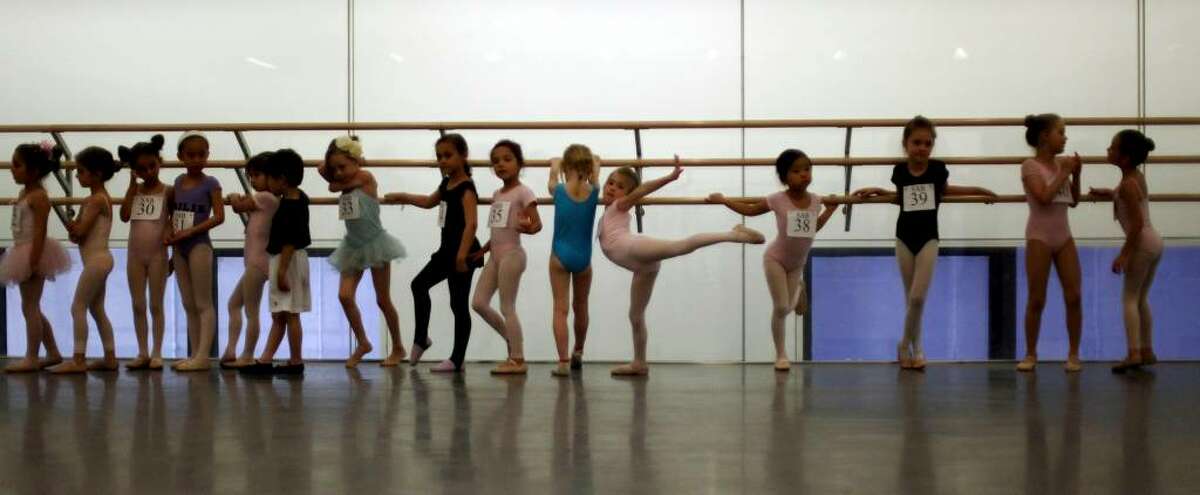 Children line up before auditioning for the School of American Ballet, Monday, April 19, 2010 in New York. The audition was the first in a series conducted for students between the ages of 6 and 10. (AP Photo/Mary Altaffer)