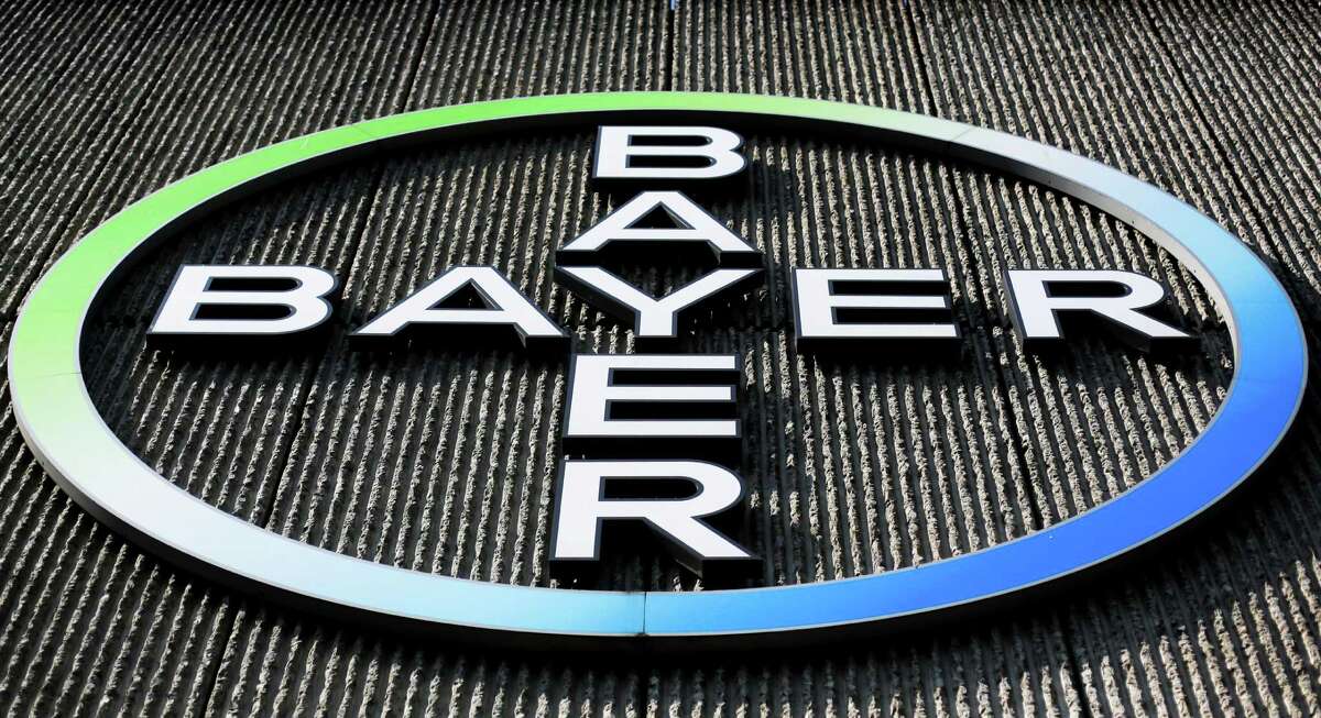 FILE - This Monday, May 23, 2016, file photo, shows the Bayer AG corporate logo displayed on a building of the German drug and chemicals company in Berlin. Monsanto is rejecting Bayer's $62 billion takeover bid, calling it "incomplete and financially inadequate. However, the seed company suggested Tuesday, May 24, 2016, that a higher bid might be accepted, saying that it remains open to talks. (AP Photo/Markus Schreiber, File) ORG XMIT: NYBZ212