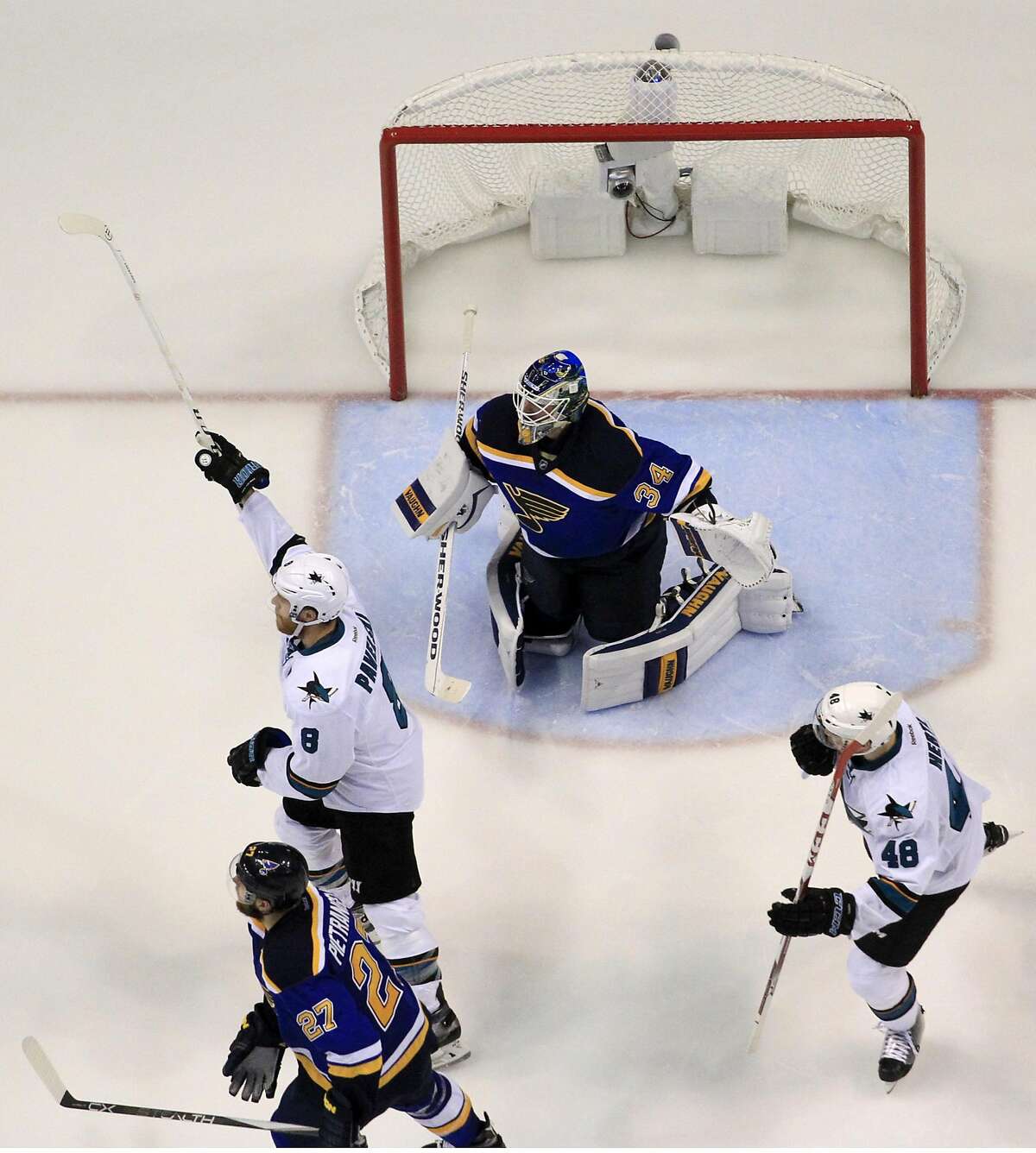 San Jose Sharks center Joe Pavelski (8) celebrates after scoring a goal against St. Louis Blues goalie Jake Allen (34) during the third period in Game 5 of the NHL hockey Stanley Cup Western Conference finals, Monday, May 23, 2016, in St. Louis. (AP Photo/Jeff Roberson)