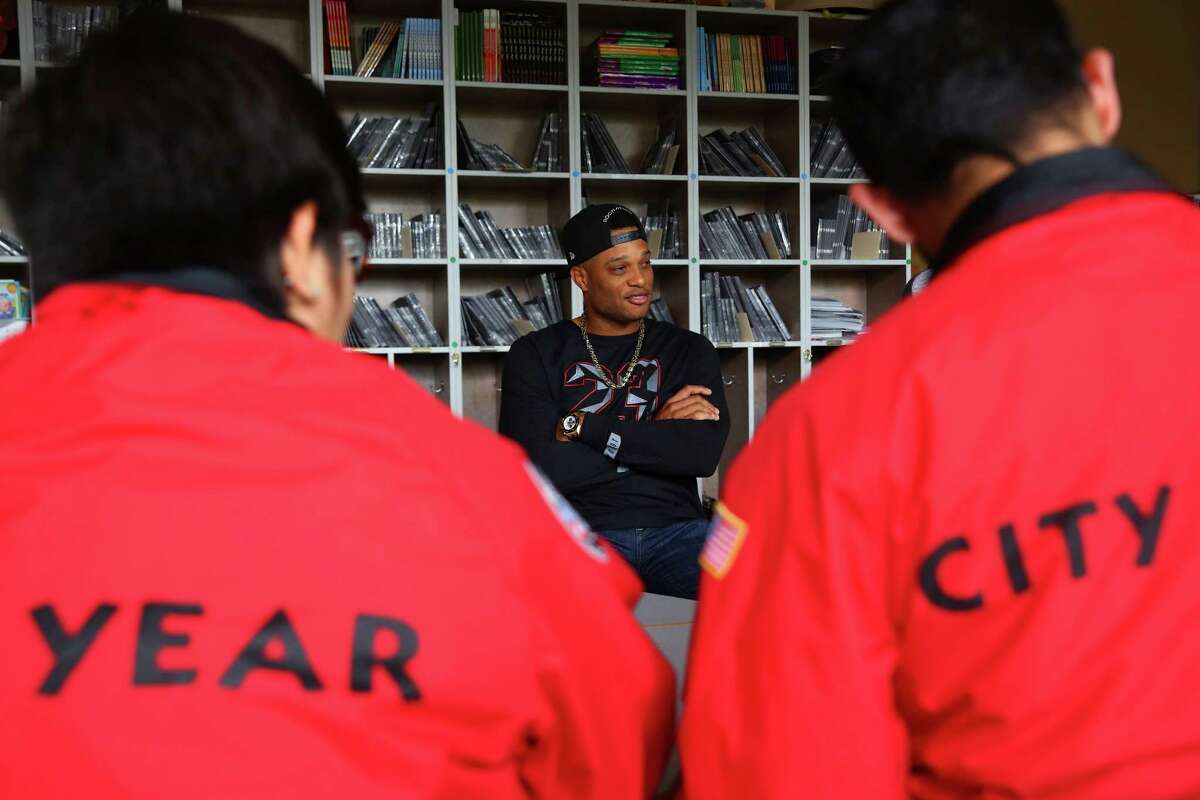 Seattle Mariner Robinson Cano talks with members of the AmeriCorps City Year team at Concord International School, Tuesday, May 24, 2016. Cano sponsors the City Year team at Concord as they work with bi-lingual students as peer mentors.