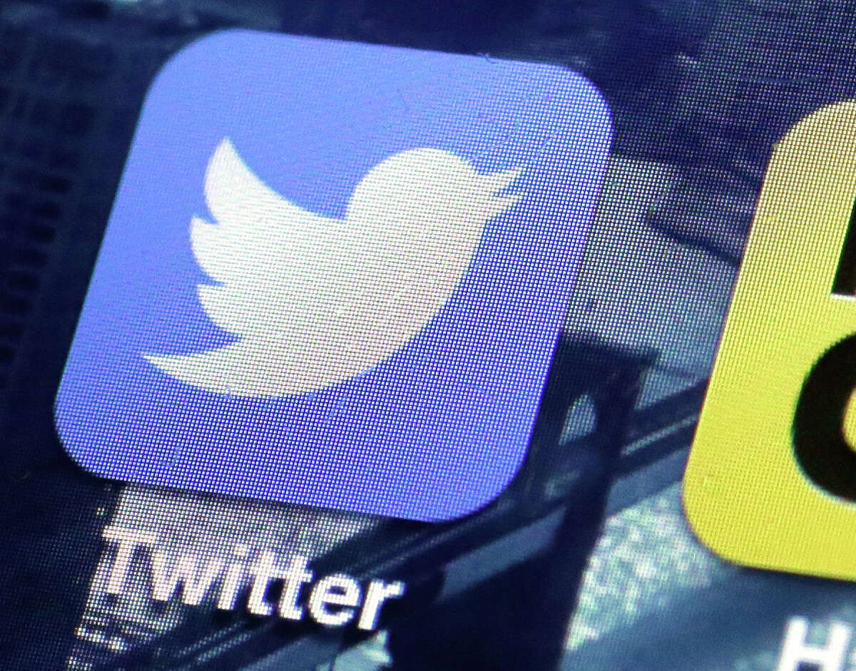 A Twitter app is on an iPhone screen. A change announced Tuesday is another try by the company to make its service easier to use, and to attract new users. ﻿
