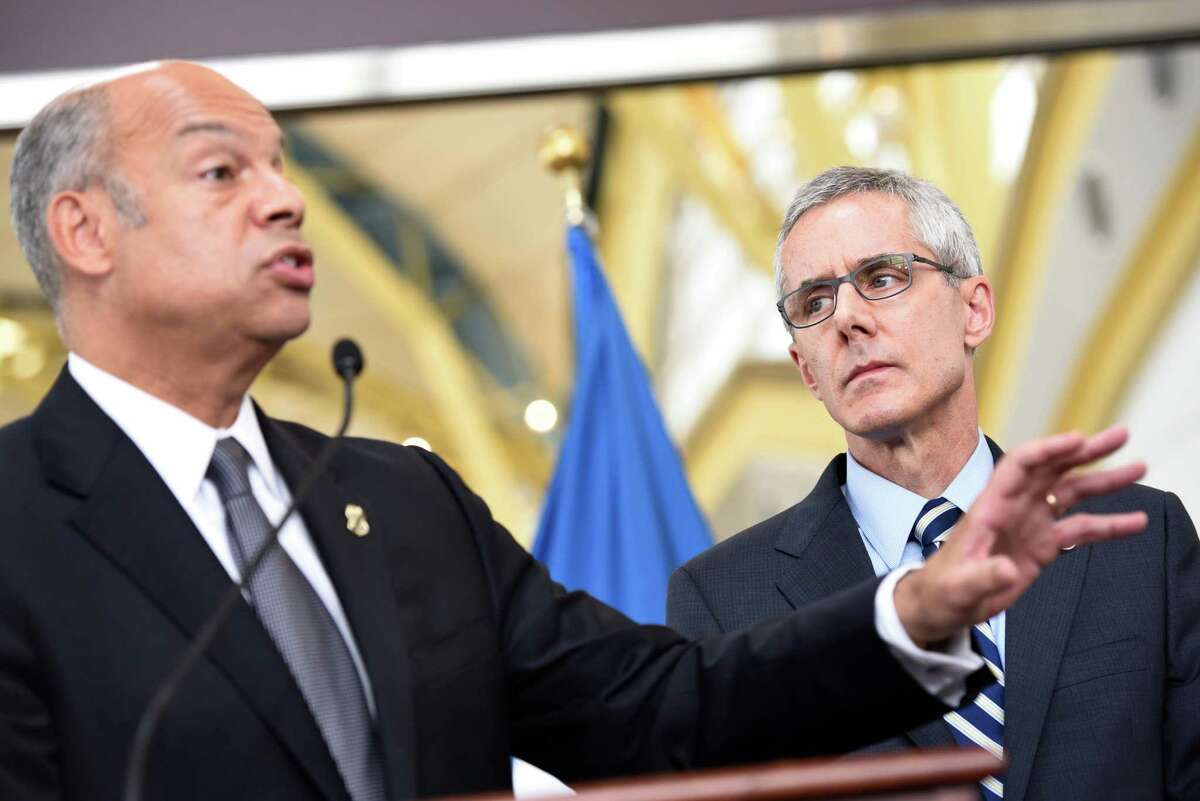Transportation Security Administration (TSA) Administrator Peter Neffenger listens at right as Homeland Security Secretary Jeh Johnson speaks at news conference on airport security, Friday, may 13, 2016, at Washington's Ronald Reagan National Airport. Fliers across the country have been facing growing lines, which during peak hours have topped 90 minutes at some airports. The TSA has fewer screeners and has tightened security procedures. Meanwhile, more people are flying. (AP Photo/Sait Serkan Gurbuz)