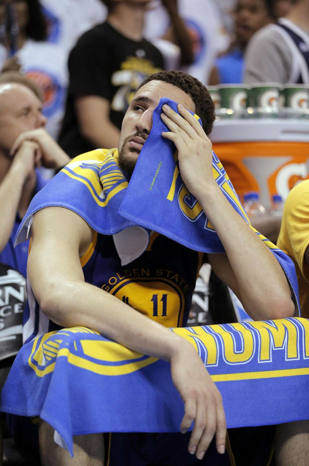 Klay Thompson (11) sits on the bench in the closing minutes of the second half as the Golden State Warriors played the Oklahoma City Thunder in Game 4 of the Western Conference Finals at Chesapeake Energy Arena in Oklahoma City, Okla., on Tuesday, May 24, 2016. The Thunder defeated the Warriors 118-94, to take a 3 games to 1 lead.