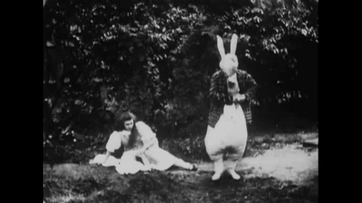 Alice and the White Rabbit in the 1903 "Alice in Wonderland," the first known film adaptation of Lewis Carroll's tale. Credit: Courtesy of BBC/Warner