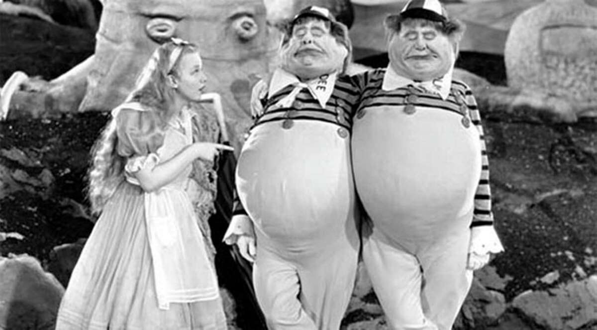 Alice (Charlotte Henry) with Tweedledee (Roscoe Karns) and Tweedledum (Jack Oakie) in "Alice in Wonderland" (1933). Credit: Courtesy of Universal Studios Home Entertainment