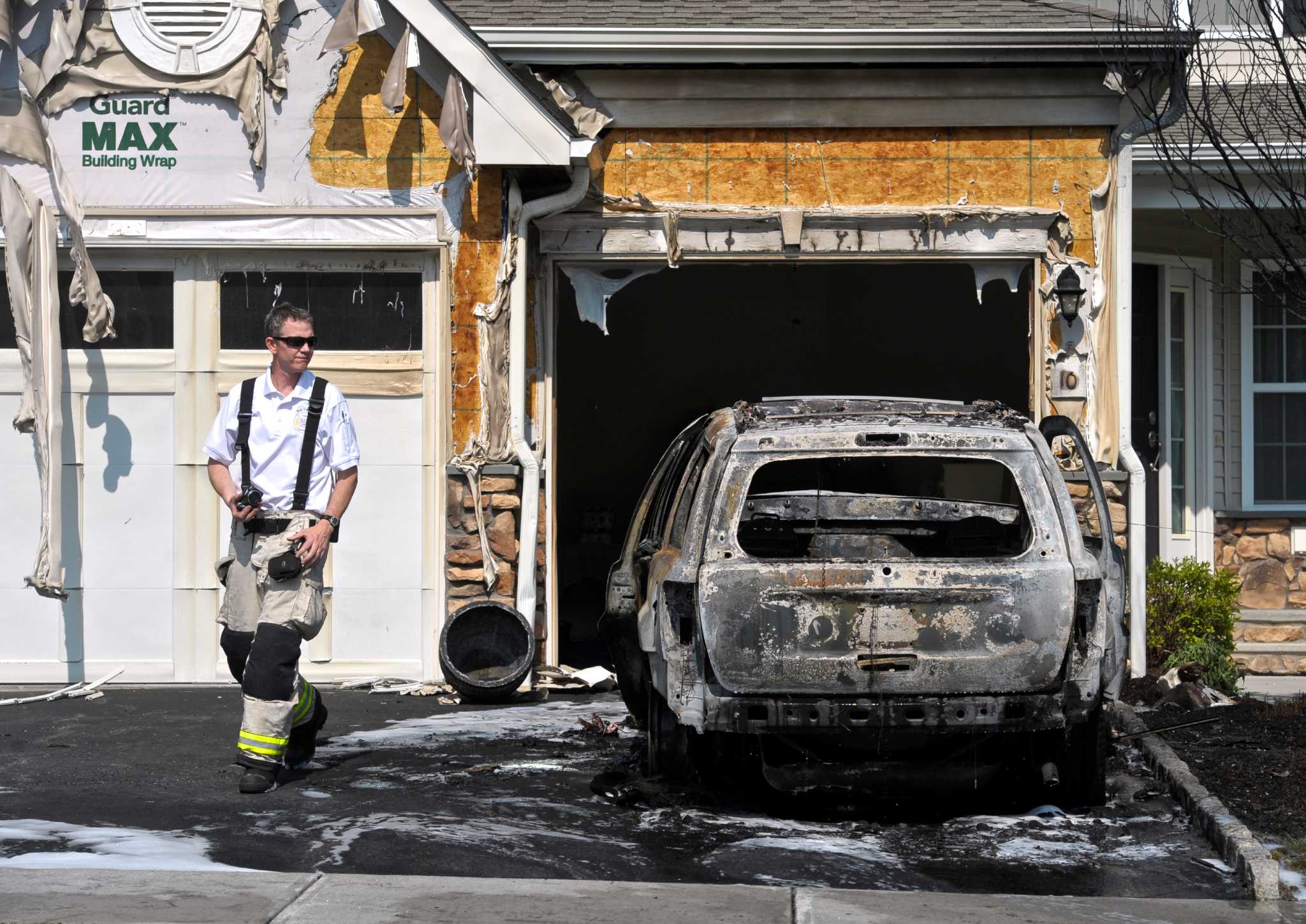 Car parked in Bethel driveway totaled in blaze