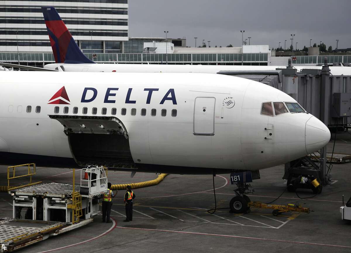In this file photo made June 7, 2010, a Delta Airlines Inc. plane sits on the tarmac at Seattle-Tacoma International Airport in Seattle. 