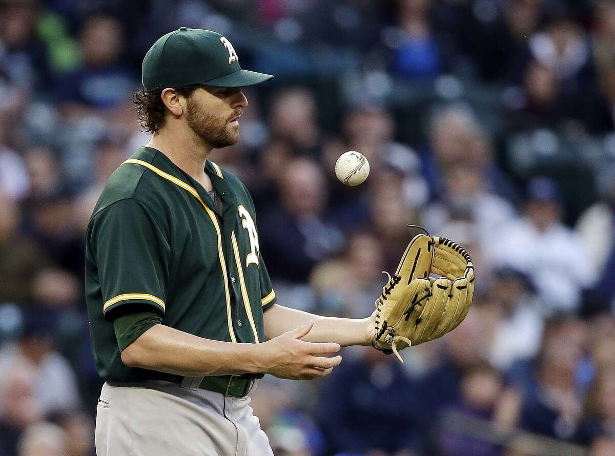 Oakland Athletics starting pitcher Zach Neal flips the ball after giving up a hit to the Seattle Mariners during the third inning of a baseball game Wednesday, May 25, 2016, in Seattle.