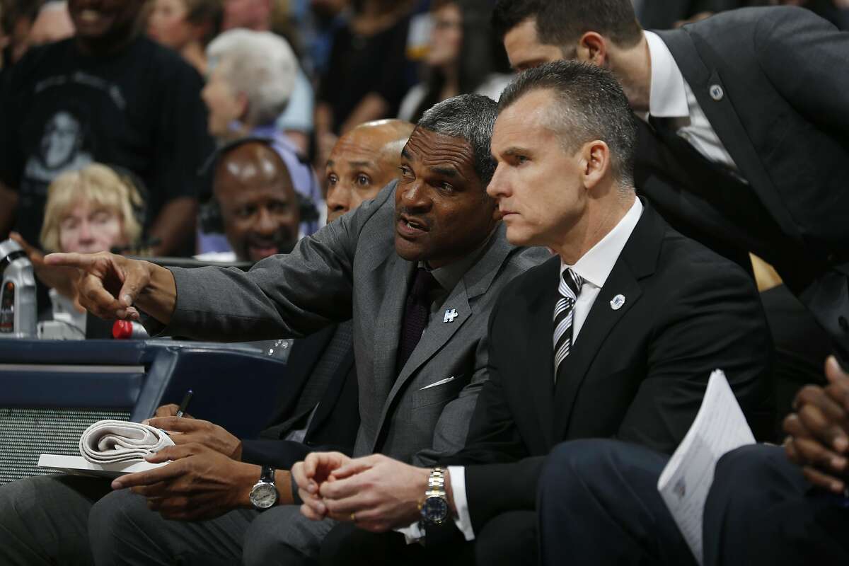 Oklahoma City Thunder assistant coach Maurice Cheeks, back, confers with Oklahoma City Thunder head coach Billy Donovan in the first half of an NBA basketball game Tuesday, April 5, 2016, in Denver. (AP Photo/David Zalubowski)
