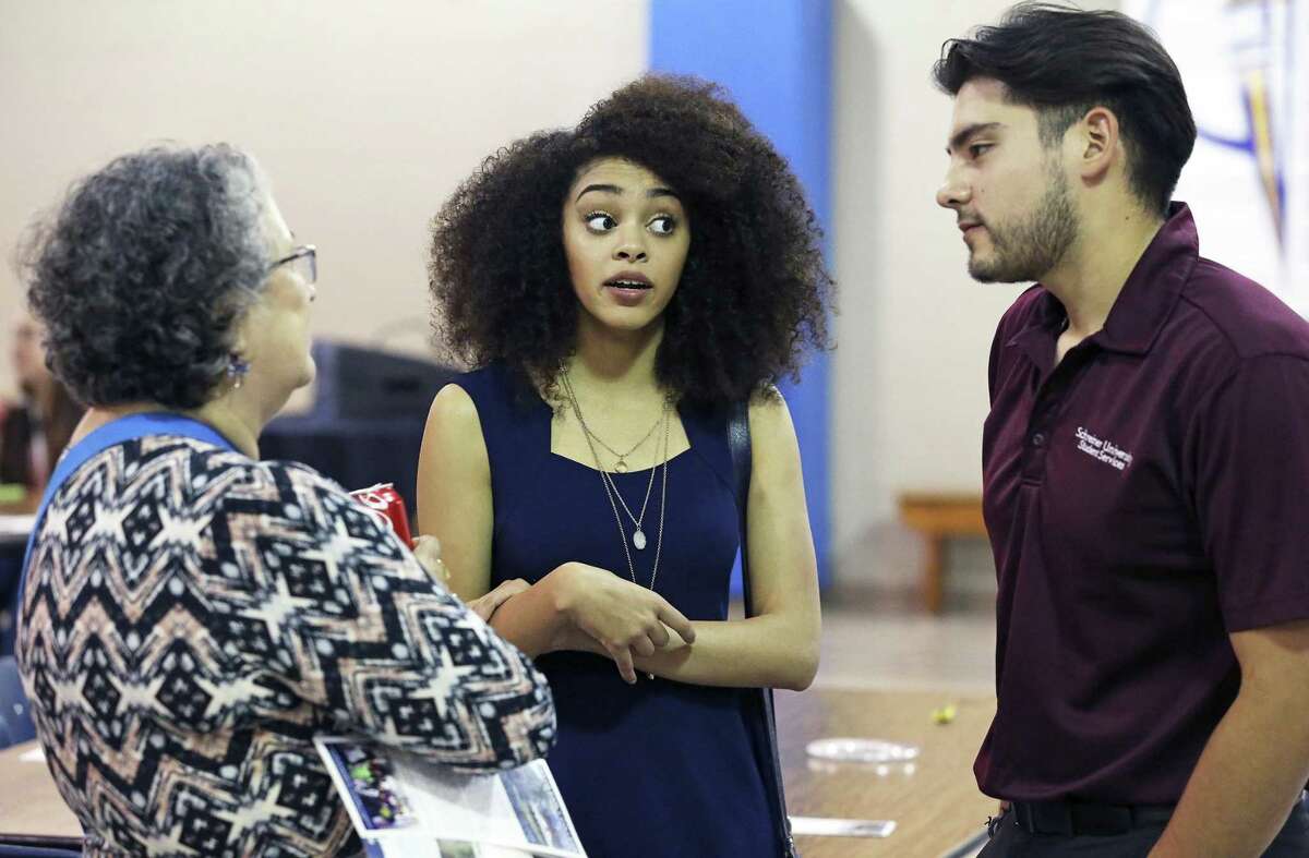 Savanna Villanueva revisits Travis Early College High School in 2016, where she had graduated at age 15, and talks with Nellie Gomez Shannon (a school supporter) and classmate Andrew Arnold. The Greehey Foundation has committed $1.5 million to help the San Antonio Independent School District teach dual credit students for the next three years.