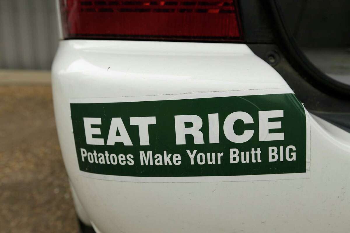 A bumper sticker encouraging people to enjoy rice is placed on Roberts' car. ﻿