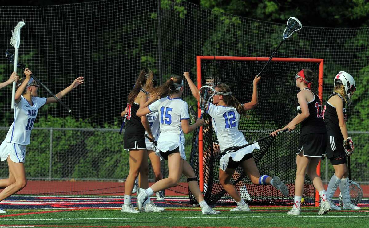 Darien Susannah Ropp(12) celebrates her winning goal against New Canaan in a FCIAC Girls Lacrosse Final at Brien McMahon High School in Norwalk, Conn. on May 26, 2016. Darien defeated New Canaan 12-11 in over-time.