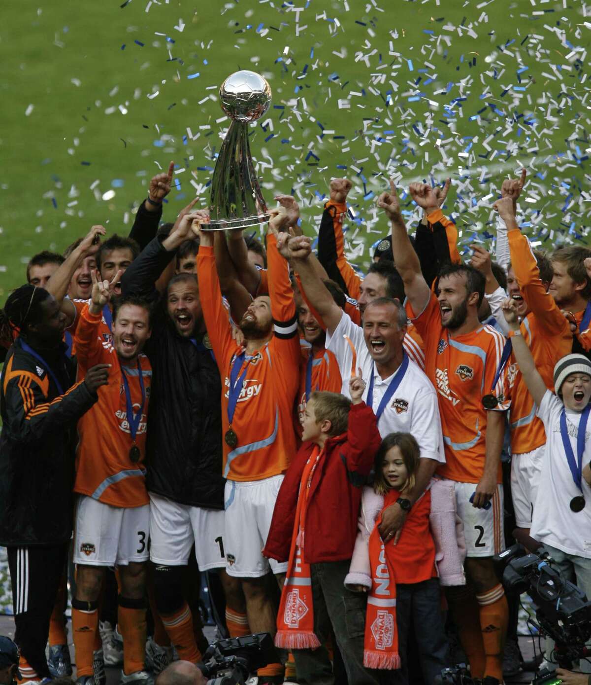 Wade Barrett hoisted the MLS Cup in 2007 after Dominic Kinnear, to Barrett's left, coached the Dynamo to the championship. Barrett may take over Kinnear's old job after Owen Coyle's stint as Kinnear's successor ended this week.