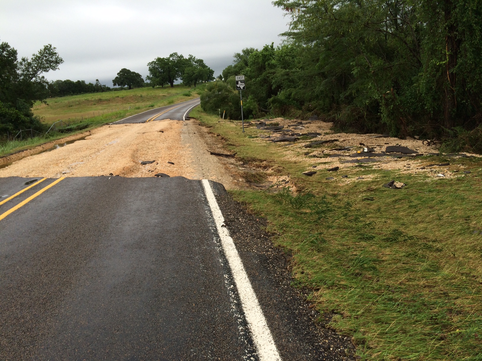 Flooding Opens Giant Sinkhole In Road North Of Houston - Houston Chronicle