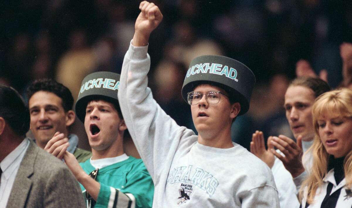 On April 4, 1993, two fans wear 