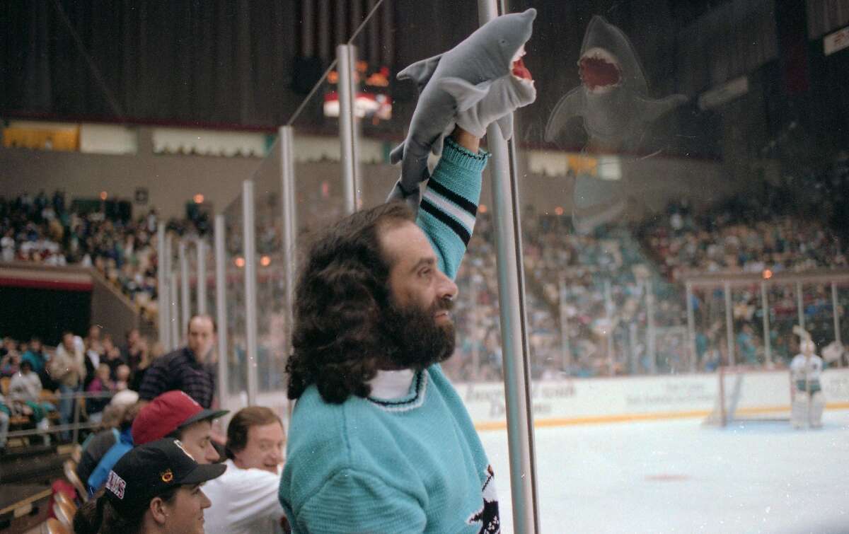 A fan with front-row seats brings a shark puppet during the team's early years when NHL hockey was played at the Cow Palace in Daly City.