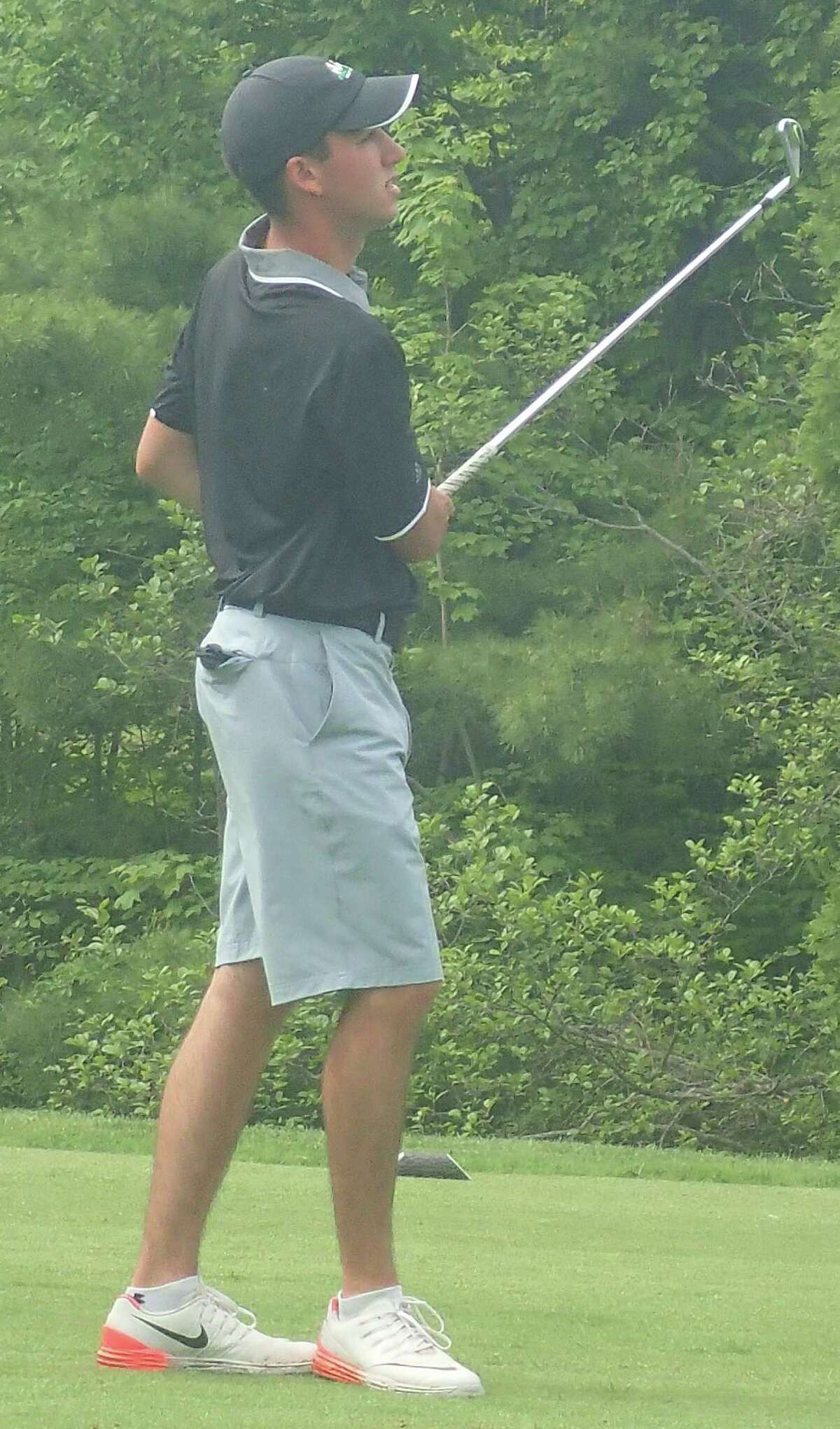 Masuk's Ryan Simmeth watches his tee shot on the 10th hole at Ridgewood Country Club in Danbury during the SWC boys golf championships May 27, 2016.
