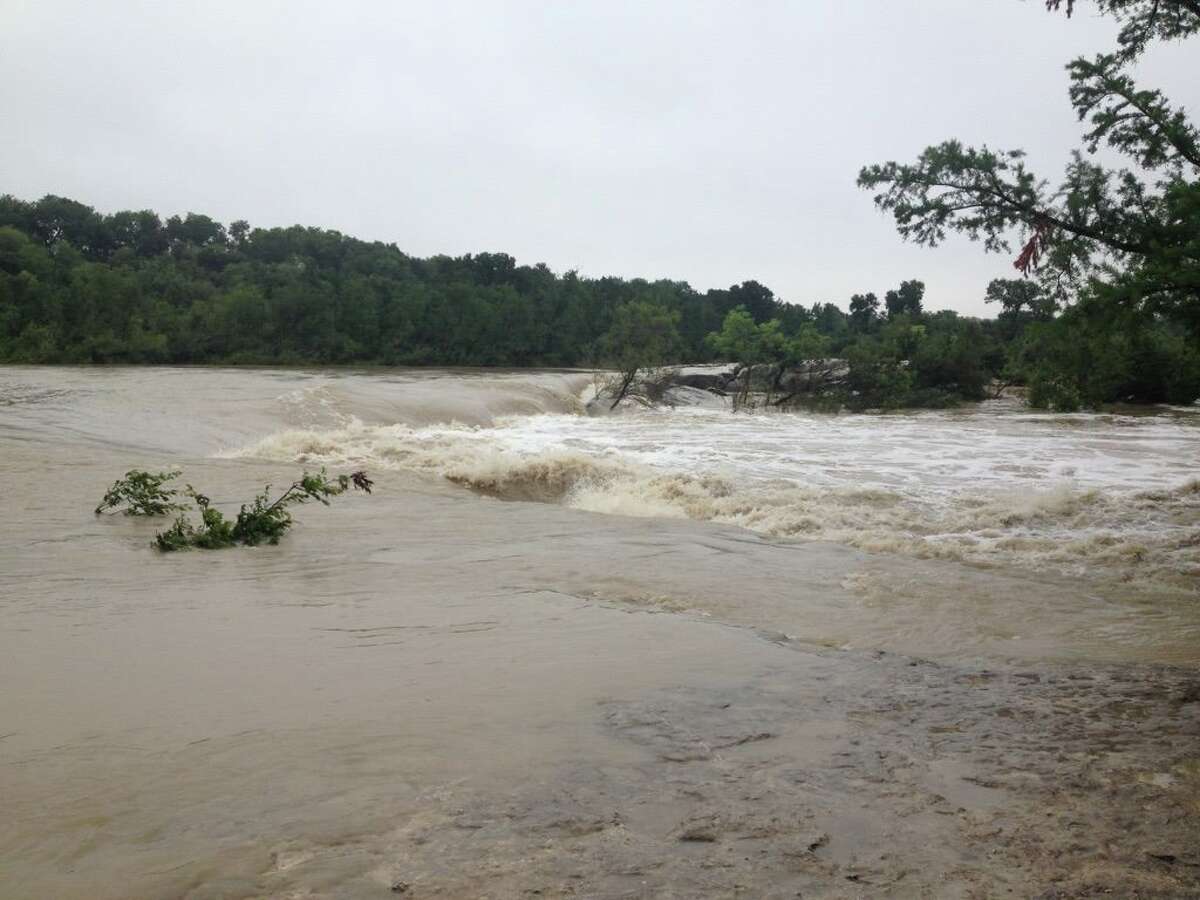 Heavy rains have caused flooding at some Texas state parks, like this view from McKinney Falls in Austin.
