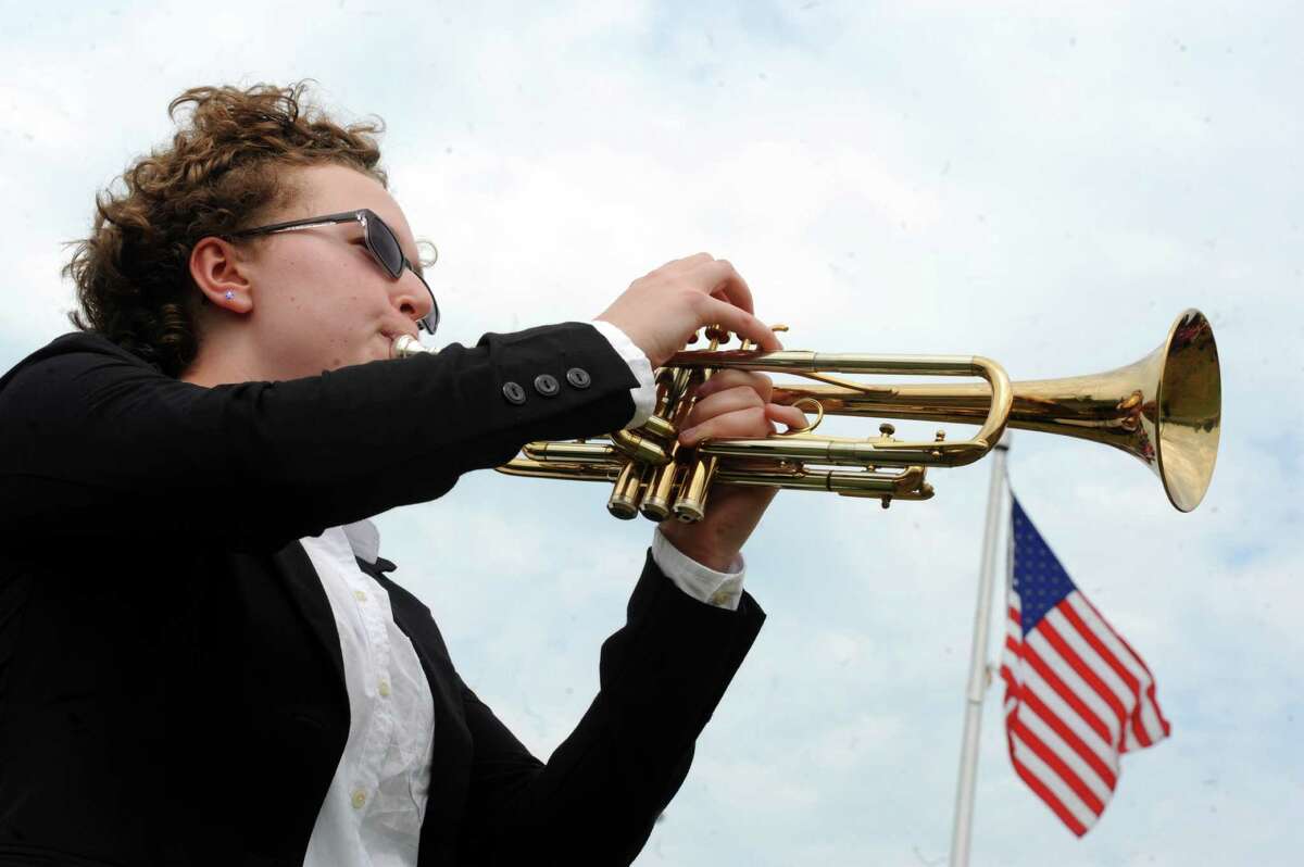 Senior Olivia Canavan plays "Taps" during Niskayuna High School's annual Memorial Day ceremony to honor graduates who serverd in the armed forces on Friday May 27, 2016 in Niskayuna, N.Y. (Michael P. Farrell/Times Union)