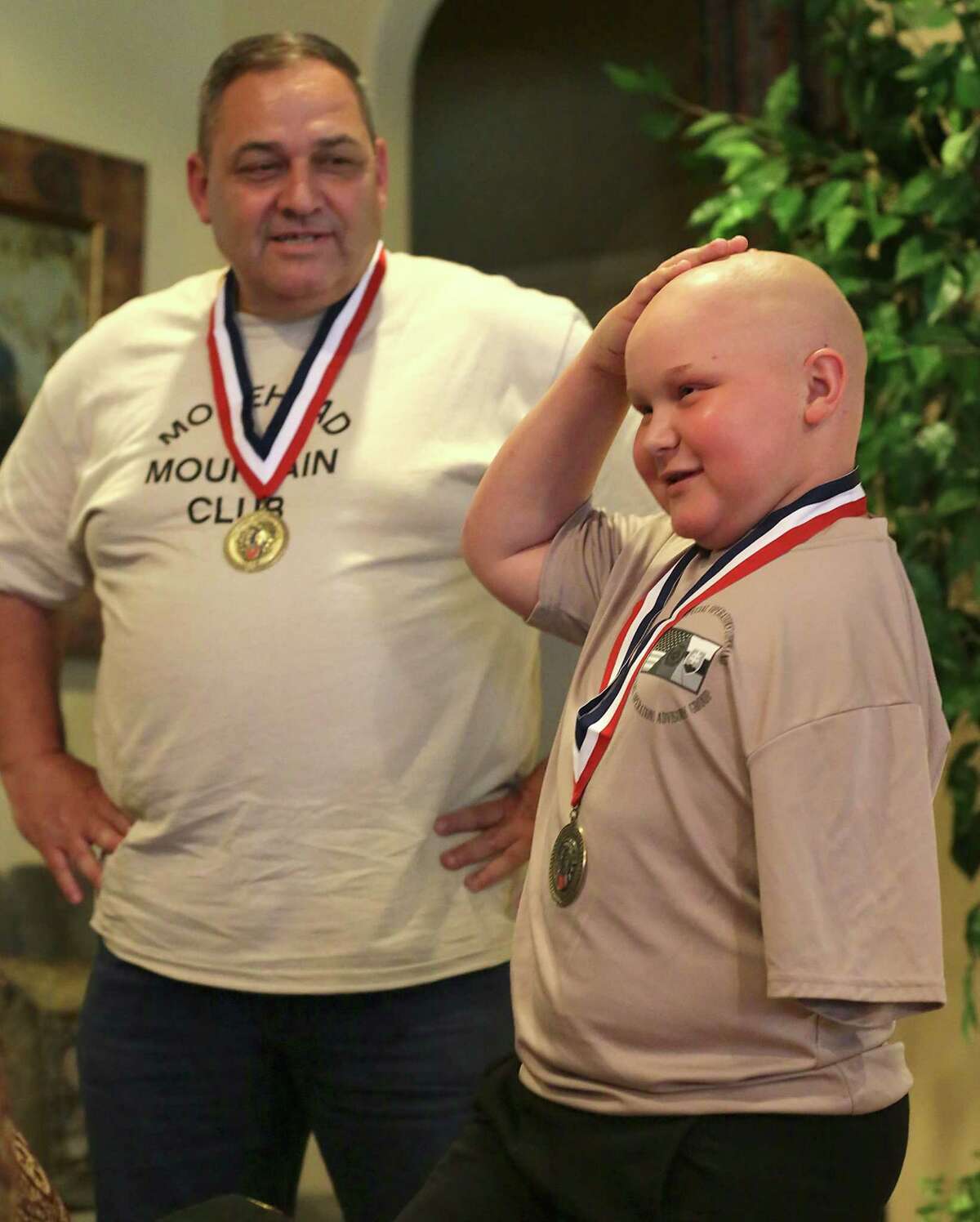 Lt. Col Jerry Touchet listens to his inspirational young friend cancer patient Damon Billeck, 12, as they finally got a surprise meeting on Friday, May, 27, 2016, after writing to each other and sending gifts over the past two years.