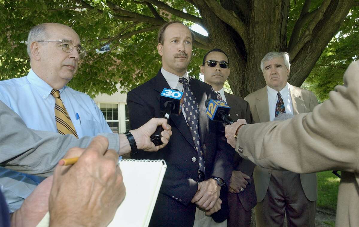 Town officials hold a press conference ( in front of the school) to discuss the bomb scare Tuesday morning at the Newtown Middle School. Left to right, schools superintendent John Reed, Police Chief Mike Kehoe, Captain Joe Rios and First Selectman Herb Rosenthal
