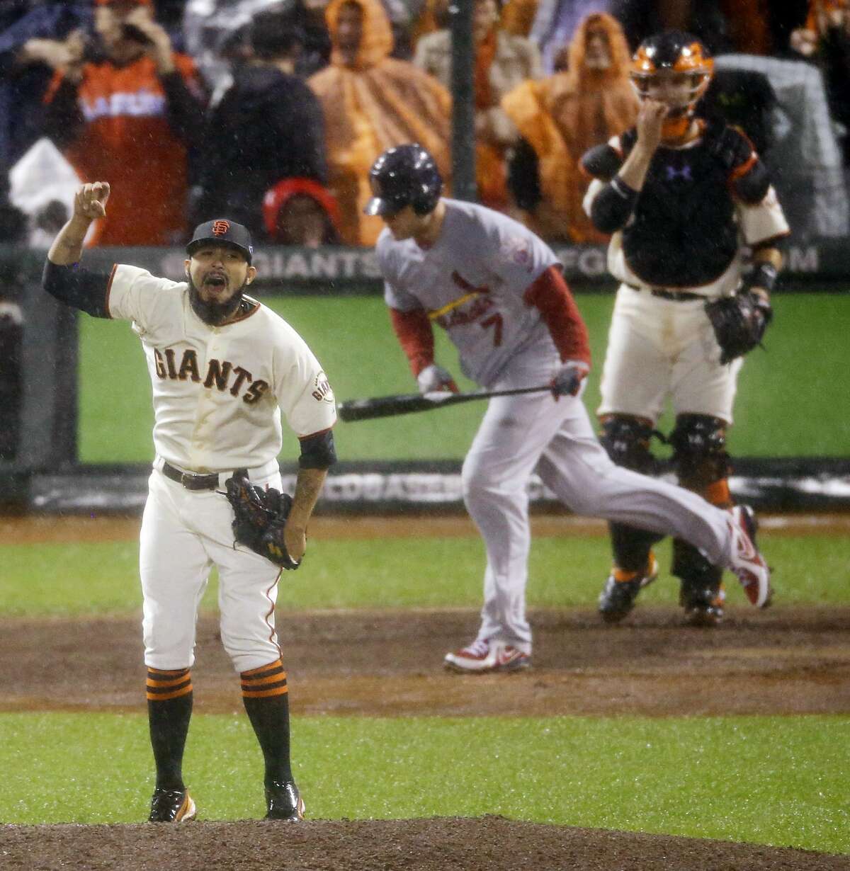 San Francisco Giants relief pitcher Sergio Romo reacts after St. Louis Cardinals' Matt Holliday flies out to end Game 7 of baseball's National League championship series against the St. Louis Cardinals Monday, Oct. 22, 2012, in San Francisco. The Giants won 9-0 to win the series. (AP Photo/Mark Humphrey)