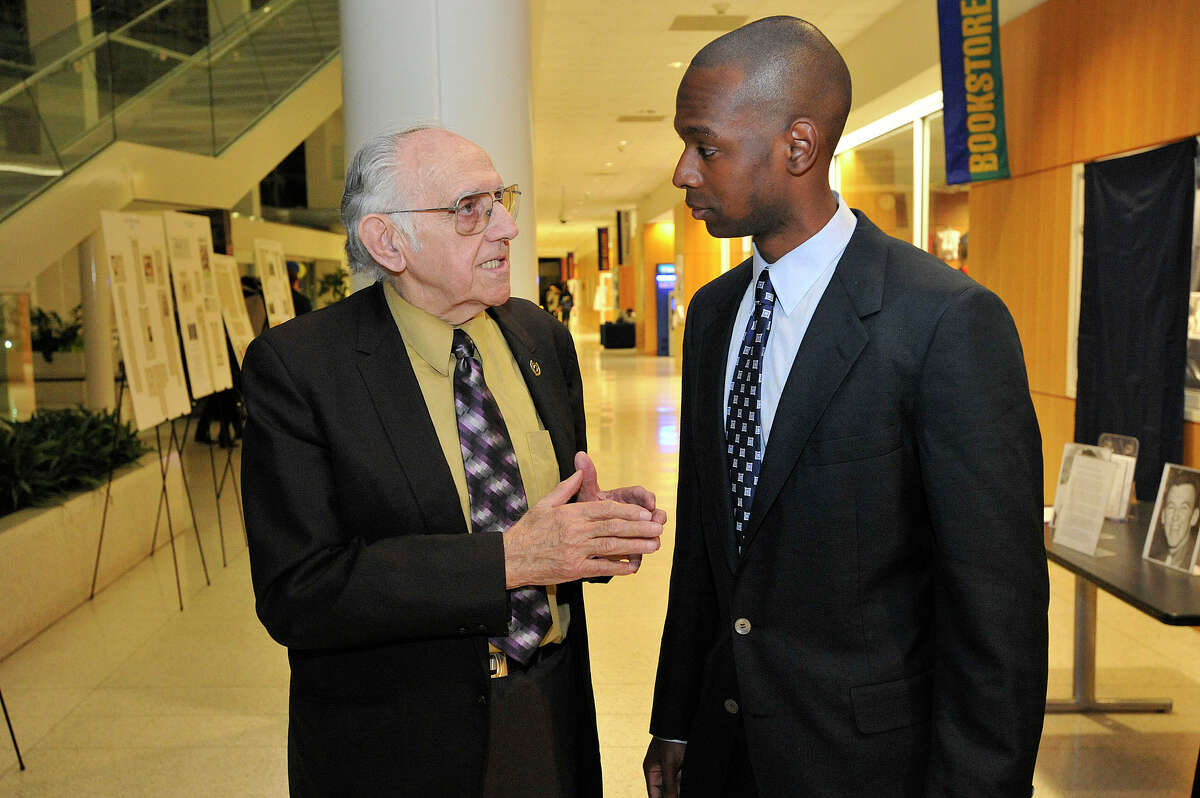 Inductees former Stamford Mayor Bruno Giordano, left, and Craig Austrie chat during the UConn Fairfield County Sports Hall of Fame induction and dedication ceremony of the UConn wing of the Fairfield County Sports Hall of Fame to Dr. David Mazza at University of Connecticut's Stamford campus in Stamford, Conn., on Thursday, Nov. 13,2014.