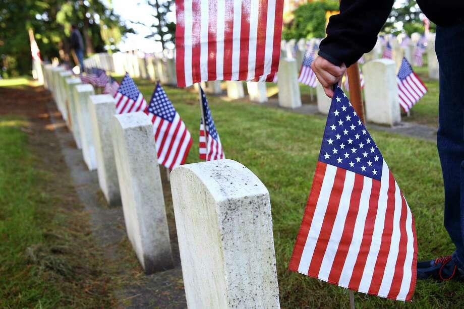 Memorial Day flag placement at Washelli Cemetery
