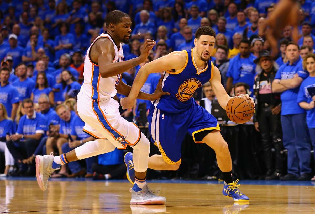 OKLAHOMA CITY, OK - MAY 28: Klay Thompson #11 of the Golden State Warriors drives against Kevin Durant #35 of the Oklahoma City Thunder during the fourth quarter in game six of the Western Conference Finals during the 2016 NBA Playoffs at Chesapeake Energy Arena on May 28, 2016 in Oklahoma City, Oklahoma. NOTE TO USER: User expressly acknowledges and agrees that, by downloading and or using this photograph, User is consenting to the terms and conditions of the Getty Images License Agreement. (Photo by Maddie Meyer/Getty Images)