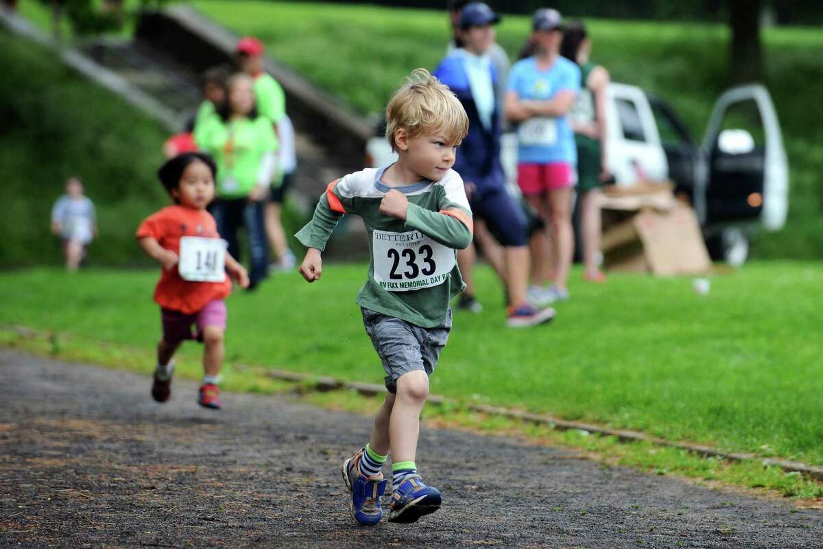 Five-year old Campbell Kelly pumps his arms as he competes in the kids fun run, which took place after the Jim Fixx Greenwich Memorial Day Road Race, on Monday, May 30, 2016. Photos from the 52nd annual Jim Fixx Greenwich Memorial Day Road Race on an overcast Monday, May 30, 2016.