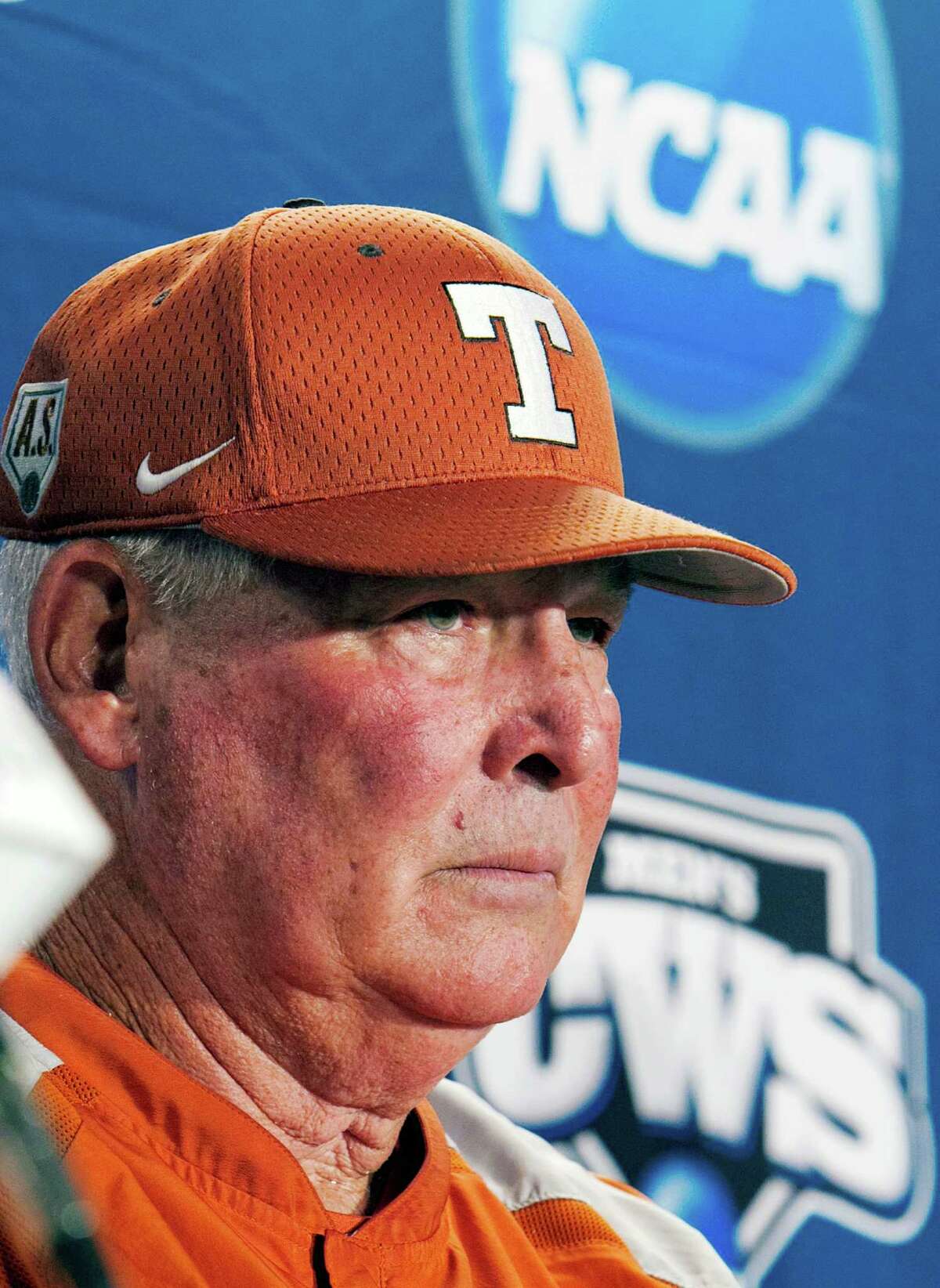 FILE- In this June 17, 2011, file photo, Texas coach Augie Garrido takes a question during an NCAA college baseball news conference at TD Ameritrade Park in Omaha, Neb.Garrido, the winningest coach in college baseball history, is out after 20 seasons at Texas. The decision Monday, May 30, 2016, comes after the Longhorns' first losing season since 1998. (AP Photo/Nati Harnik, File)