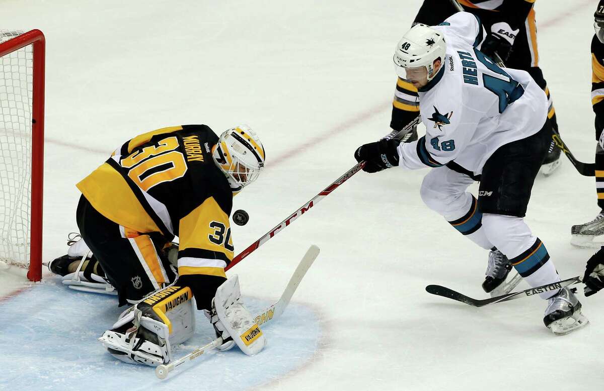 Pittsburgh Penguins goalie Matt Murray (30) stops a shot by San Jose Sharks' Tomas Hertl (48) during the third period in Game 1 of the Stanley Cup final series Monday, May 30, 2016, in Pittsburgh. (AP Photo/Gene J. Puskar)