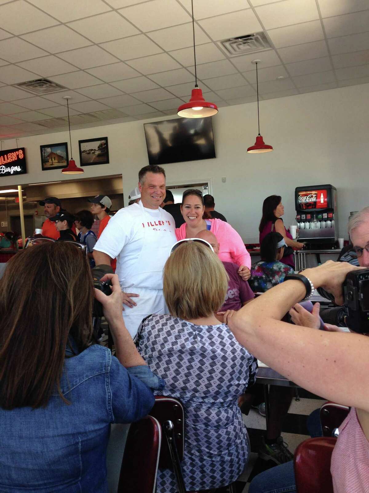 Scenes from the opening of Killen's Burgers, 2804 S. Main St., Pearland, on May 28. Shown: Ronnie Killen poses for a photo with a fan.