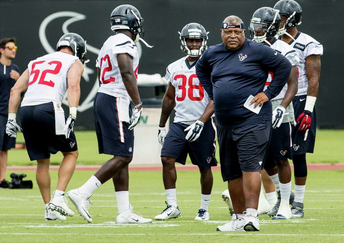 Houston Texans defensive coordinator Romeo Crennel watches warm ups during OTAs at The Methodist Training Center on Tuesday, May 31, 2016, in Houston.